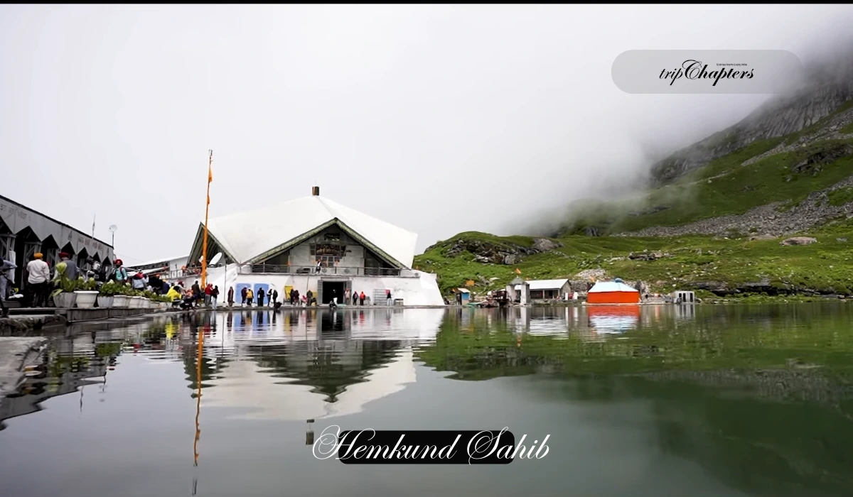 Hemkund Sahib gurudwara by a misty monsoon lake