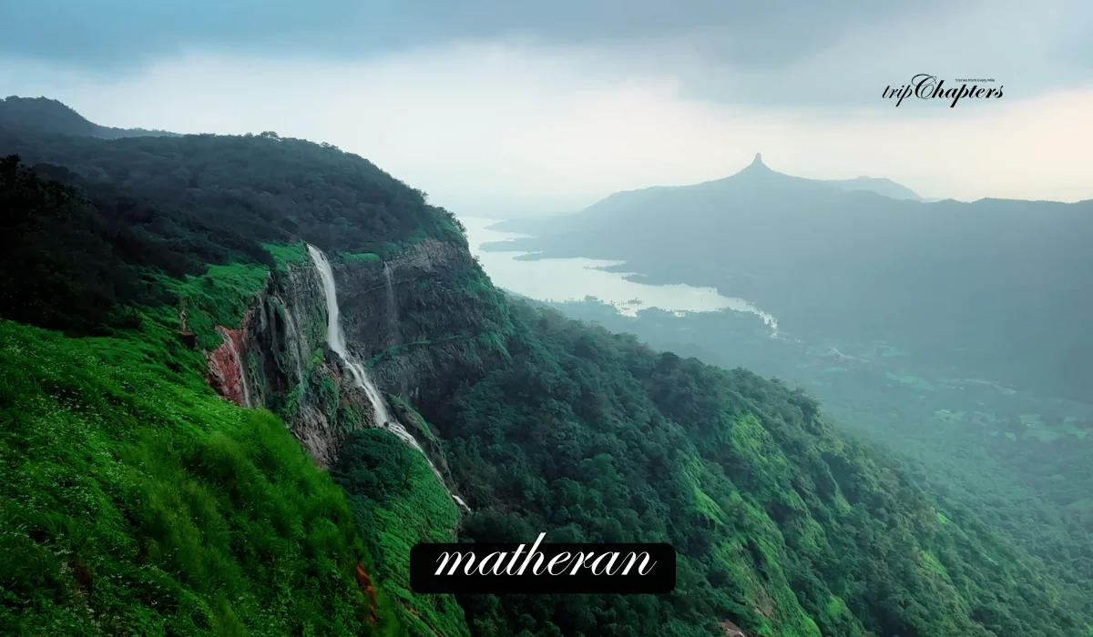 Matheran waterfall cascading down a green cliff with a valley