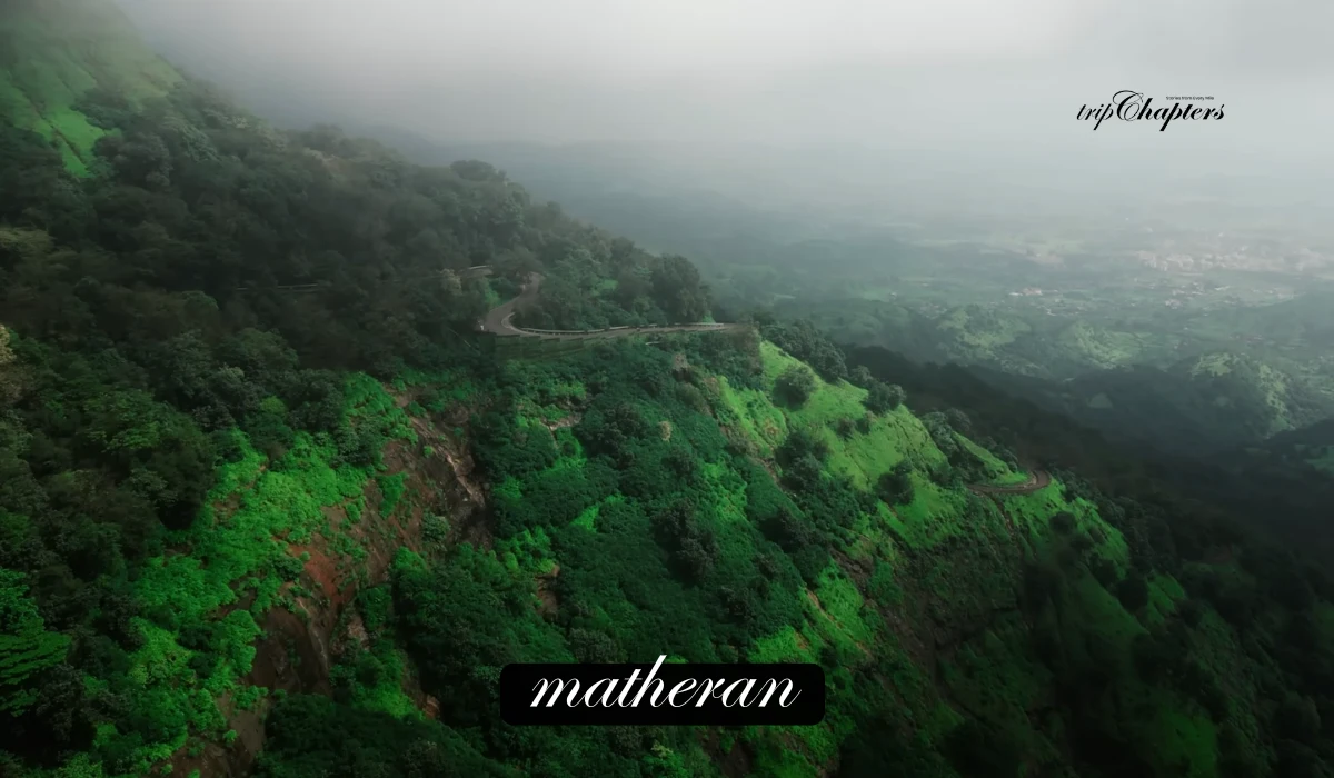 Misty green mountains and winding road in Matheran