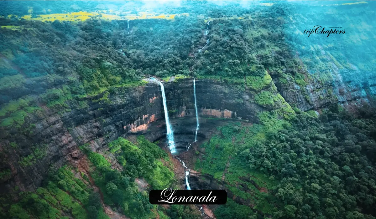 Waterfalls gushing down a vibrant green, rain-drenched mountainside in Lonavala